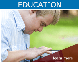 goal Education; Student with down syndrome playing on tablet